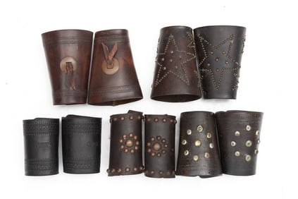 Collection of 5 pairs of vintage leather Roping Cuffs. Two pair are marked  "F.A. Meanea, Cheyenne".