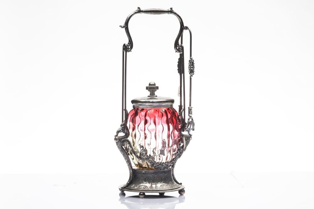 ATTENTION COLLECTORS OF VINTAGE SILVER AND GLASS PICKLE CASTORS, FROM ONE ESTATE:: ATTENTION COLLECTORS OF VINTAGE SILVER AND GLASS PICKLE CASTORS, FROM ONE ESTATE: Cranberry Fluted Pickle Castor on silver footed stand with embossed birds supporting handle, 12 1/2" T, marked "Rogers