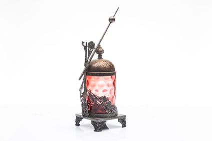 Cranberry coin dot Pickle Castor on silver stand marked "Meriden Company", fancy footed stand