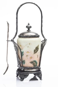 Cased glass custard color hand decorated Pickle Castor with fork in a very unusual silver stand. Has