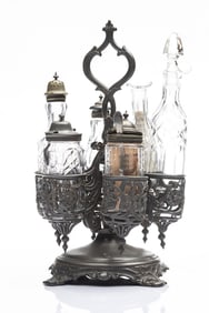 Fancy silver and glass Cruet Set on revolving footed stand, very good condition though one glass
