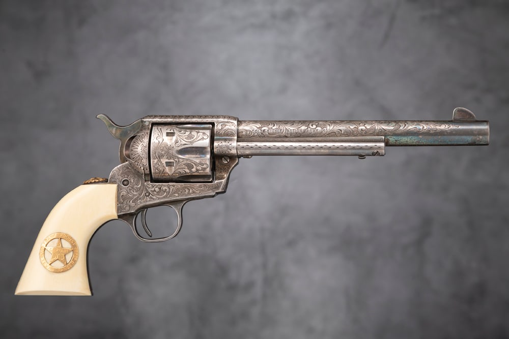 Engraved Colt SAA Texas Ranger Commemorative Revolver, SN 67T*R, in original display case. This is
