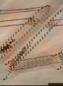 Fine custom iron Saddle Stand with silhouettes of cowboys on bucking horses on each end and a row of