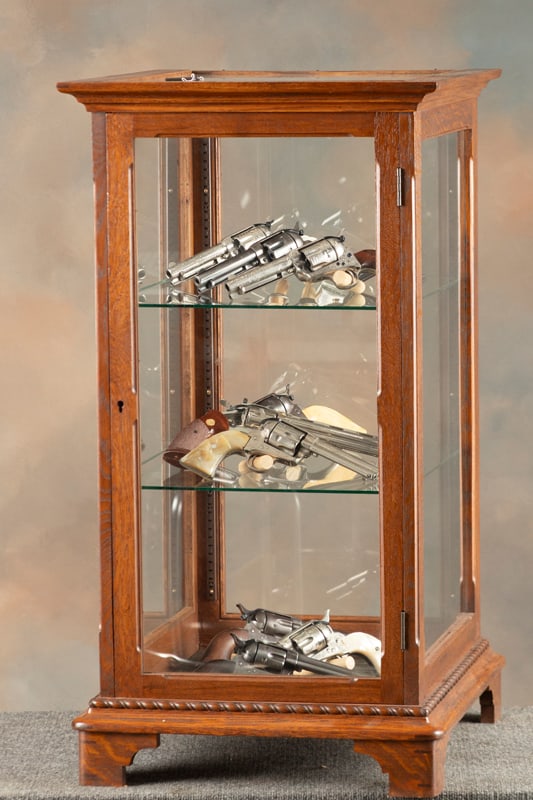 Unique oak and glass floor model Showcase, attributed to J.W. Winchester Co., with full length glass: Unique oak and glass floor model Showcase, attributed to J.W. Winchester Co., with full length glass doored entry and adjustable glass shelves, excellent finish and condition with locking door. Unique