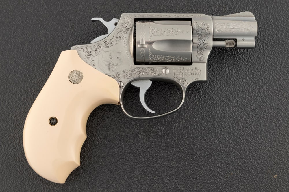 Smith & Wesson, Model 60-3, Double Action Revolver, .38 SPL caliber, SN BEC5239, stainless, 2": Smith & Wesson, Model 60-3, Double Action Revolver, .38 SPL caliber, SN BEC5239, stainless, 2" barrel, engraved by R. Lutz, with custom S&W grips and engraved Tiger on right side of frame and floral r