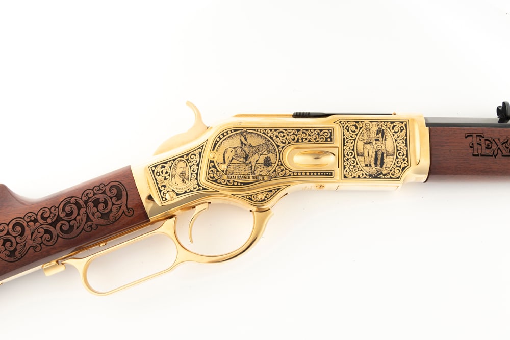 Beautiful Uberti, Model of 1873, LA Rifle, .44/40 caliber, SN CAT5987, blue 20" octagon barrel with: Beautiful Uberti, Model of 1873, LA Rifle, .44/40 caliber, SN CAT5987, blue 20" octagon barrel with receiver, lever, trigger, hammer and forearm cap in gold plate. Engraved receiver marked "Texas Rang