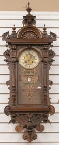 Beautiful antique carved walnut Calendar Wall Clock with eight day time and strike, circa 1890s,