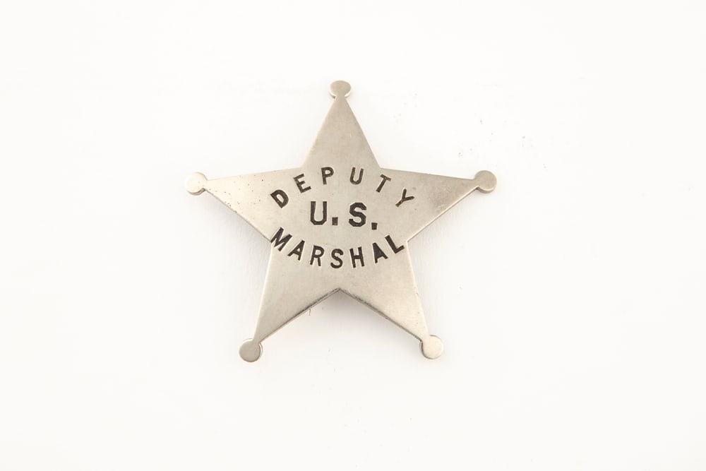 Silver colored vintage 5-point Ball Star Badge marked “DEPUTY U.S. MARSHAL??, has working pin and: Silver colored vintage 5-point Ball Star Badge marked “DEPUTY U.S. MARSHAL”, has working pin and catch, measures 2 ¼” T x 2 ¼” W. The sticker on back of badge says it