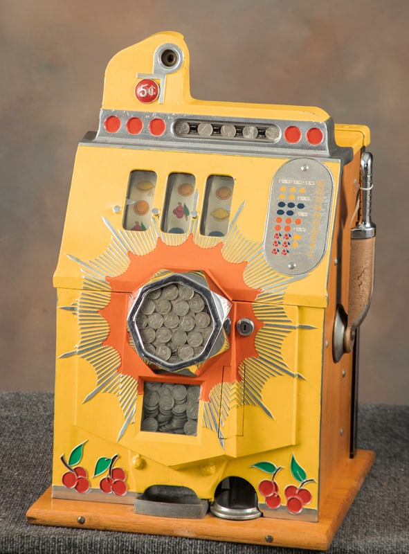 Antique Mills Bursting Cherry, 5 Cent Slot Machine, circa 1930s, SN 407829. Machine measures 24 1/2": Antique Mills Bursting Cherry, 5 Cent Slot Machine, circa 1930s, SN 407829. Machine measures 24 1/2" T, base is 16" W x 15" L, double money front, good working order, does pay off, sold with keys. All