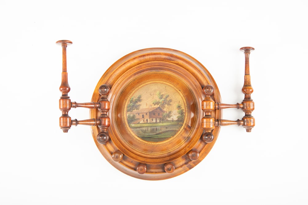 Very unusual antique round 13" dia. wall hanging Coat & Hat Rack with hand painted scene in center.: Very unusual antique round 13" dia. wall hanging Coat & Hat Rack with hand painted scene in center. NOTE: The unusual swivel hat racks. In very good finish and condition. The Late Jim Holley Estate.
