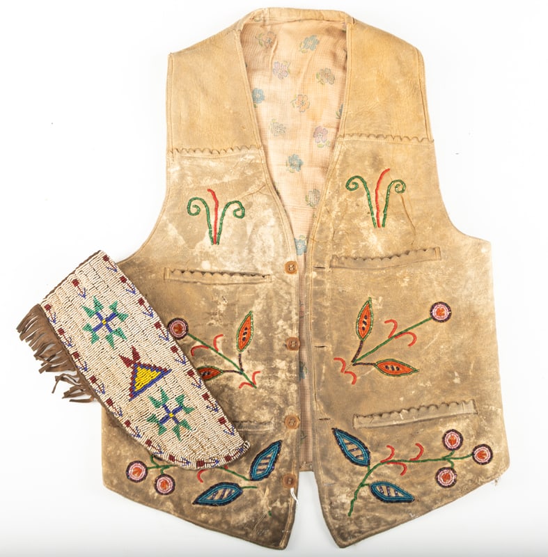 This lot consists of the following two Items: A Wild West beaded doe skin Vest with inside pockets: This lot consists of the following two Items: A Wild West beaded doe skin Vest with inside pockets that are made from trades cloth. Outside of vest is in fair condition, inside is fragile. Accompanied