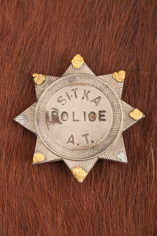 Small vintage 8-point Star Badge marked “SITKA POLICE A.T.??, is a very unusual designed badge: Small vintage 8-point Star Badge marked “SITKA POLICE A.T.”, is a very unusual designed badge with what appears to be small gold nuggets on the tip of each point. Has small post pin and Burges