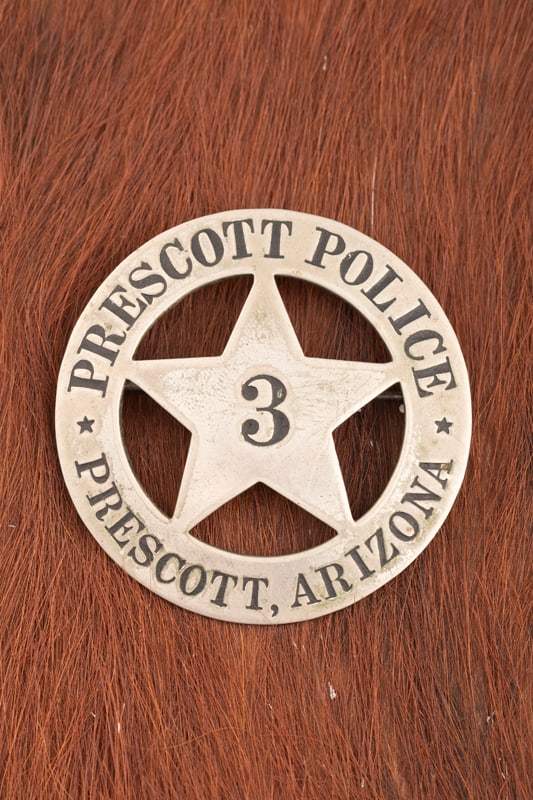 Vintage Circle Badge with 5-point cut-out Star center marked “PRESCOTT POLICE PRESCOTT, ARIZONA: Vintage Circle Badge with 5-point cut-out Star center marked “PRESCOTT POLICE PRESCOTT, ARIZONA” with “3” in center of Star. Badge measures 2 ¼’ D, has spring pin with catch. 