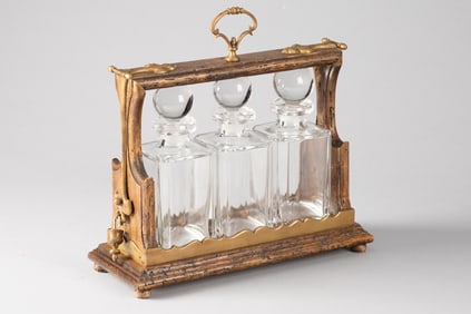Unique wooden and brass Tantalus (Portable Liquor Case) with three matching crystal decanters with