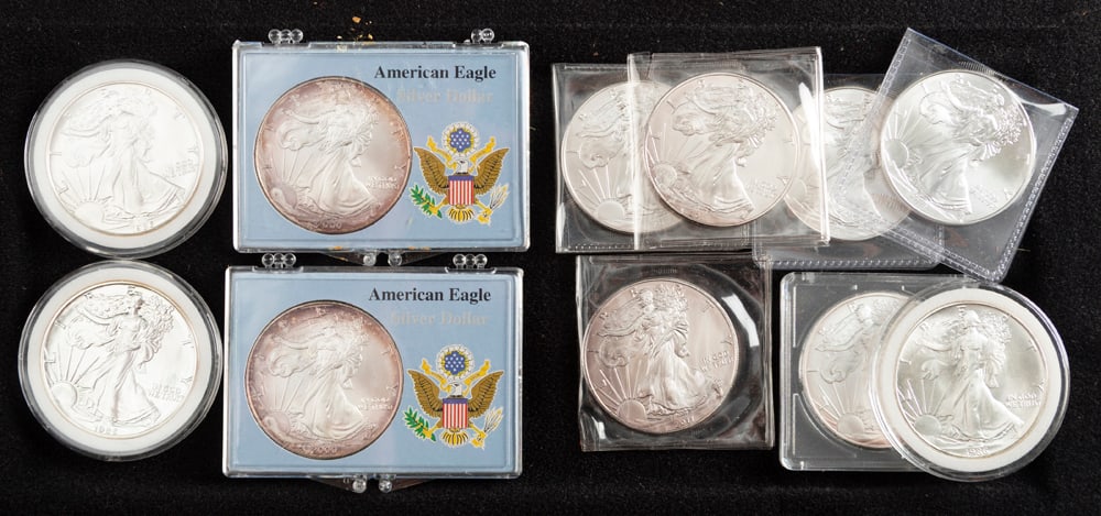 THIS LOT WILL BE SOLD 11 TIMES YOUR BID, MEANING YOUR FINAL BID WILL BE MULTIPLIED 11 TIMES:: THIS LOT WILL BE SOLD 11 TIMES YOUR BID, MEANING YOUR FINAL BID WILL BE MULTIPLIED 11 TIMES: Collection of 11 American Eagle Silver Dollars, 1 ounce of fine silver-one dollar. There are two-1986, one-
