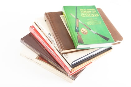 Collection of seven Books from the personal Library of C.W. Lyle to include: (1) "John M. Browning