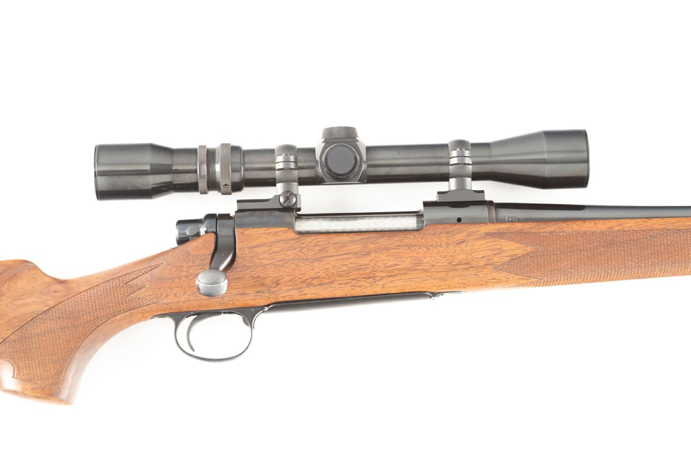 Remington, Model 700, Bolt Action Rifle, .30/06 caliber, SN A3201722, excellent blue finish, 22": Remington, Model 700, Bolt Action Rifle, .30/06 caliber, SN A3201722, excellent blue finish, 22" barrel, excellent wood with checkered forend and pistol grip, 13 1/2" trigger pull. Mounted with a Weav