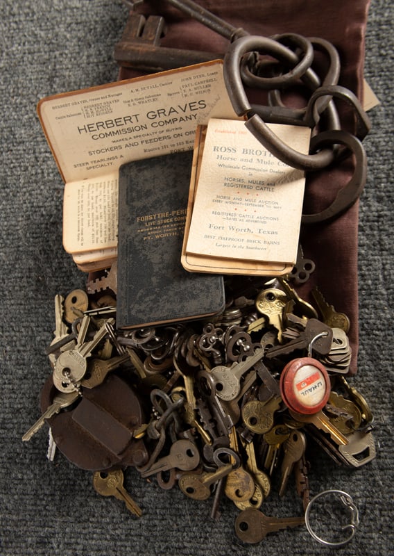 This lot consists the following Items. An actual authentic set of Jailer's Keys. A vintage Canvas: This lot consists the following Items. An actual authentic set of Jailer's Keys. A vintage Canvas Bag marked "South Fort Worth/State Bank/Fort Worth, Texas", containing 100-150 different keys. Four sm