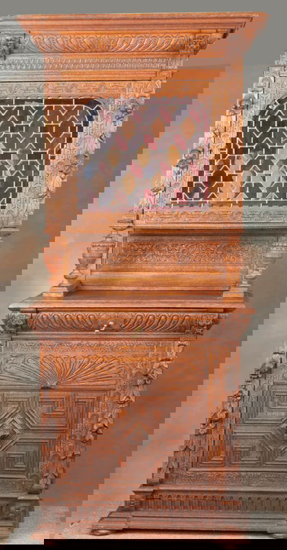 Beautiful antique leaded and stained glass, oak two-piece, step back Bar, in original finish and: Beautiful antique leaded and stained glass, oak two-piece, step back Bar, in original finish and condition, circa 1900, has carved lion heads and fruit on each outside column, highly carved header and