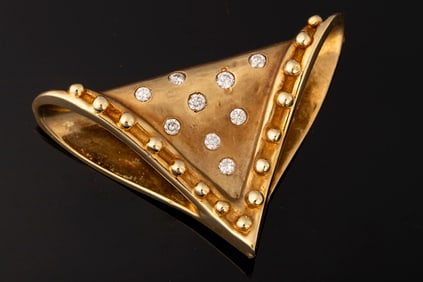 Ladies 14kt yellow gold slide pendant containing nine round brilliant cut diamonds approximately