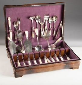 Group of 30 pieces of mismatched "Sterling" marked Flatware with mother of pearl handles, sold in a