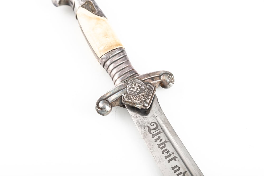 Model 1937 Reichs Arbeits Dienst (RAD) Leader’s Dagger by Carl Eickhorn, Solingen. Scabbard is: Model 1937 Reichs Arbeits Dienst (RAD) Leader’s Dagger by Carl Eickhorn, Solingen. Scabbard is fine with just a little scratching from wear and use. Blade etched with “Arbeit Adelt”, or “W