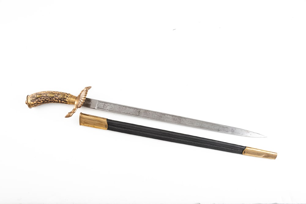 Large Imperial Hunting Cutlass (“Hirschfanger??). Made by W.K.C., Solingen, decorative etched: Large Imperial Hunting Cutlass (“Hirschfanger”). Made by W.K.C., Solingen, decorative etched blade is very fine, unsharpened and lacks dings or nicks. Standard brass fittings, clamshell, plain