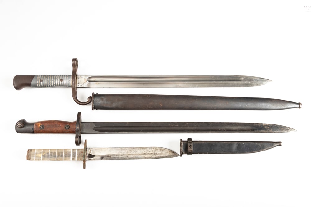 This lot consists of the following Items: A Bayonet, Model 1981, SN G7735, with matching serial: This lot consists of the following Items: A Bayonet, Model 1981, SN G7735, with matching serial numbered sheath. Ricasso is marked "WEYERSBERG KIRSCHBAUM & CO., SOLINGEN" 15 3/4" blade 20 1/2" overall