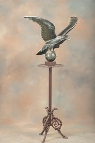 Large Eagle on metal Pedestal with footed base, 30" wing spread x 58" T. This pedestal was in Maries