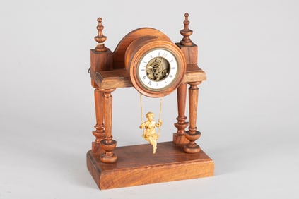 Antique French Swing Clock with gold girl on swing pendulum. Case is walnut, porcelain dial, both