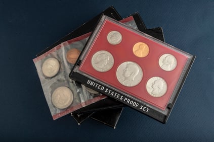 Group of seven (7) uncirculated cased U.S. Proof Sets, totaling 42 Coins. Five are dated 1980, two