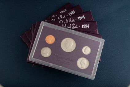 Group of five (5) uncirculated cased Proof Sets, dated 1984, totaling 25 Coins. Each case contains,