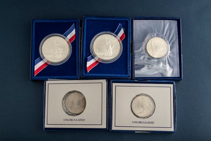 This lot has five (5) uncirculated U.S. Coins to include three (3) Uncirculated Commemorative