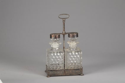 A vintage, fine quality silver and glass Tantalus (portable Bar) marked on base "Apollo Serial