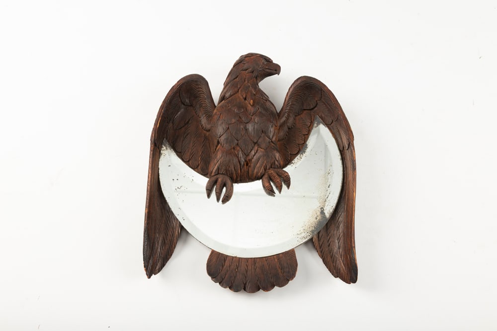 Vintage wooden hand carved wall hanging crescent shaped beveled Mirror, eagle has 9 1/2" wing spread: Vintage wooden hand carved wall hanging crescent shaped beveled Mirror, eagle has 9 1/2" wing spread with glass eyes, 12" T, in original finish. Great detail. The Late C.W. & Marie Lyle Estate.