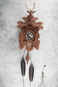 German two-weight Cuckoo Clock with stag head crest. Clock measures 16" T with removable crest.