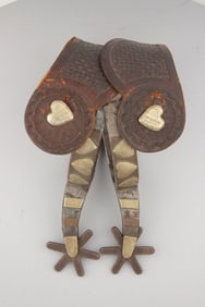 Pair of "Kelly Bros." marked, double mounted Spurs, four heart pattern, #70. Note: Etched swing
