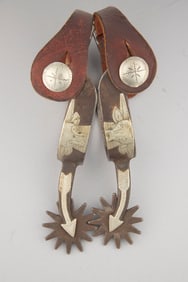Pair of inside marked "O. Crockett" single mounted Spurs, #44, with raised silver bulls head on heel