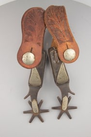Pair of inside marked "Crockett" single mounted Spurs, # 137, Ben Johnson Special, with large leaf