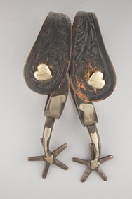 Pair of "Kelly Bros." marked, single mounted Spurs, #48, with engraved silver overlaid scrolls on