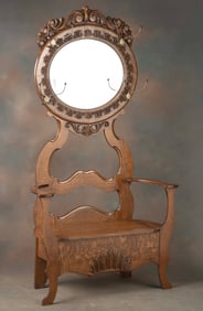 Beautiful antique lift seat, quarter sawn oak Hall Tree, circa 1900, with ornate oval carved mirror,