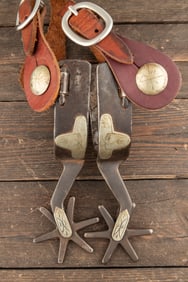 Pair of inside marked "Crockett" single mounted Spurs, #98 Red River, with sombrero on heel bands.