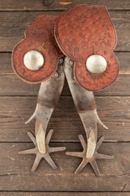 Pair of "Kelly Bros." marked single mounted Spurs, #86, with reverse arrow shanks with chap guards.