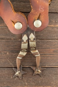 Pair of McChesney, variation of #8-2, single mounted gal-leg Spurs with desirable "Arm & Hammer"