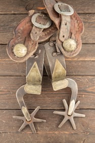 "Kelly Bros." marked, pair of single mounted Spurs, #110, with Marfa shanks, 2 3/4" rowels,. Sold