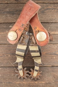 Pair of "Kelly Bros." marked single mounted Spurs, variation of #221, with chap guards, sold with