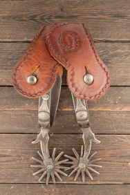 Pair of "Star" marked and forged steel August Buermann single mounted Spurs, 2 1/4" rowels with chap