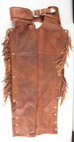 Pair of brown soft leather, fringed Chaps marked "American Pride". Very good condition.