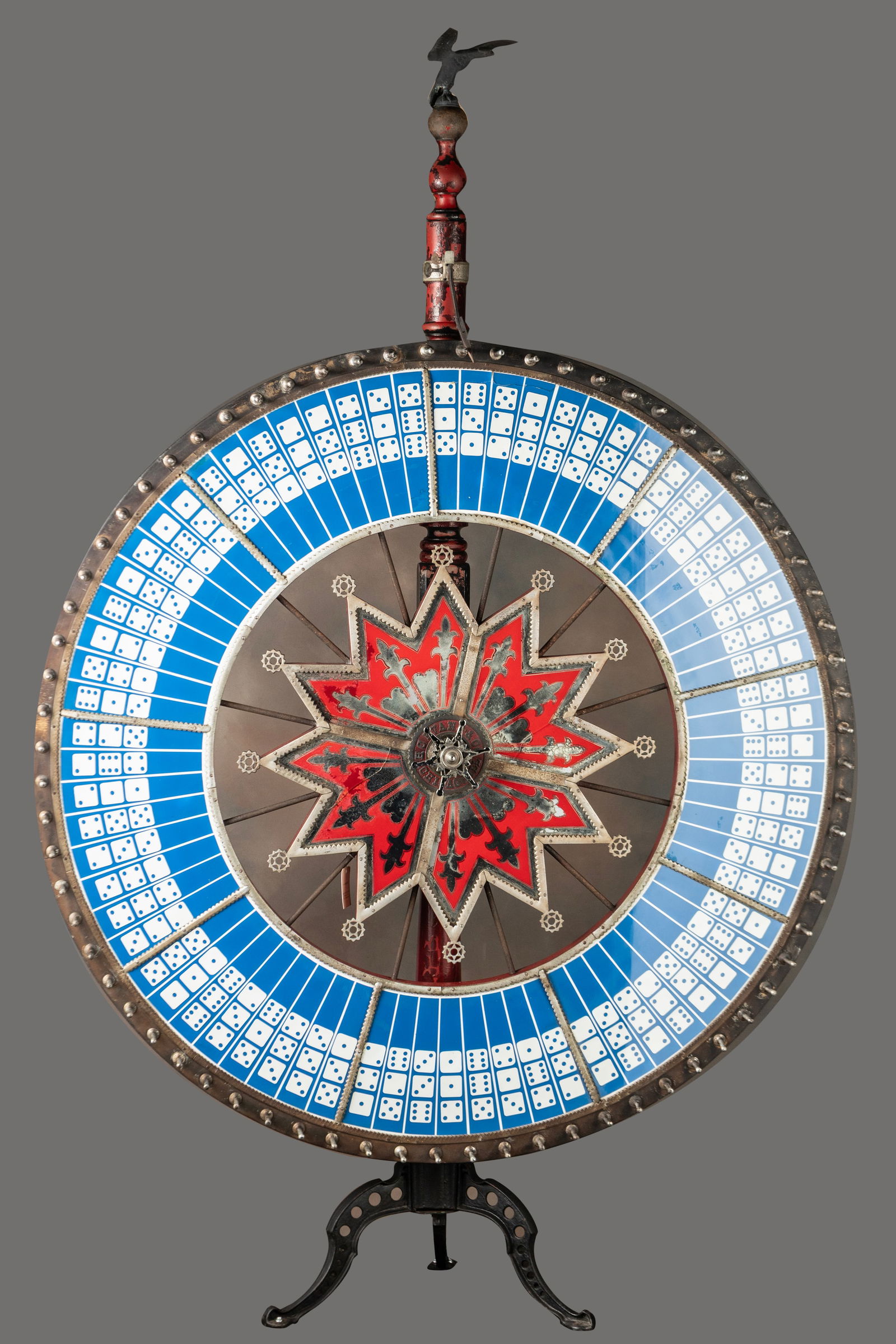 Antique Gambling Wheel with 5 ft. wheel on its original two-piece stand, with original cast iron: Antique Gambling Wheel with 5 ft. wheel on its original two-piece stand, with original cast iron footed base and eagle crest. Wheel is marked "H. C. Evans and Co., Chicago, IL." Original aged patina a