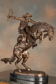 Large western Bronze Sculpture titled "The Bronc Buster", marked on base "Copyright Frederick